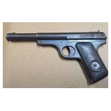 1930s Daisy No. 118 air pistol with all-metal construction, black finish and Daisy-marked grip medallion. Shows age-related surface wear and oxidation.