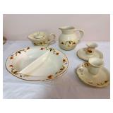 Five-piece Hall Autumn Leaf group including a divided serving dish, 1995 China Specialties limited-edition “Melody” teapot, pitcher, and two candleholders. Pieces include Hall, Autumn Leaf Club an