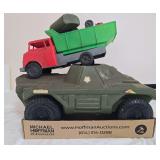 Two large vintage plastic toys including olive-drab U.S. Army-style armored vehicle and red-and-green dump truck. Includes additional loose toy pieces carried in the dump bed as shown.