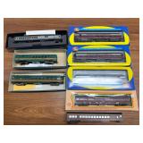Two flats of assorted model trains including Baltimore & Ohio, Northern Pacific, Atlantic Coast Line, Pennsylvania and Norfolk & Western passenger equipment as shown. Includes both boxed and loose car