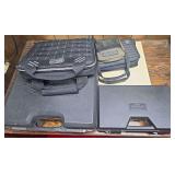 Four assorted pistol cases including hard molded and padded soft-sided examples. Includes MTM Case-Gard and Kolpin-branded cases as shown.