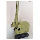 Vintage Structo tracked excavator/digger with enclosed cab, tall boom and toothed digging bucket. Light green finish with age-related scratches and paint wear.