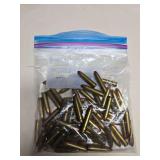 Large bag of loose .30-caliber rifle ammunition with brass cases and pointed full-metal-jacket-style bullets as shown.