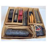 Vintage Marx train set with locomotive, rolling stock, track sections, transformer/control unit and assorted accessories housed in divided storage box as shown. Mixed condition with visible dust and a