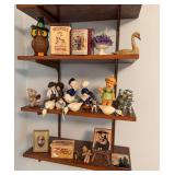 Assorted knickknacks and household decor including Wilbur’s Breakfast Cocoa and Hershey’s Milk Chocolate advertising tins, owl and swan figures, ceramic and cloth figurines, framed pieces and othe