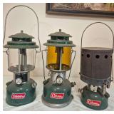 Coleman Models 220J, 220F & 502 Stove – Cataloged as Marked 6/44, 1/70 & 3/69. Includes green double-mantle lanterns, one with amber globe, together with a Coleman Model 502 single-burner stove fitt