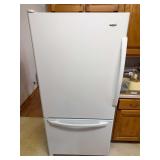 White Amana refrigerator with bottom freezer drawer and full-width door handles. Works. See handle repair