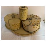Group of vintage Autumn Leaf-pattern metal kitchenware including two round cake carriers/savers with wire locking handles, a lidded cylindrical canister, and a large oval serving tray. One cake carrie