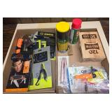Two flats of assorted knives and gun cleaning supplies including pocket tools, lubricants, cleaning accessories, small tools and related shooting items as shown.