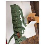 Group of AK-47-type rifle ammunition including loose cartridges, boxed ammunition, loaded stripper clip and green canvas ammunition bandolier as shown.