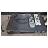 GE Digital DVD Player with Remotes. Black GE Digital component-style DVD player with Magnavox remote, universal-style remote and power cord as shown.