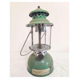 Akron Lamp Company No. 103 Pressure Lantern. Vintage pressure lantern with metal fount, clear cylindrical globe, metal ventilator and wire bail handle; shows oxidation, finish wear and age-related use