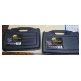 Two Plano Protector Series single-pistol hard cases with molded black construction, carrying handles and foam-lined interiors.