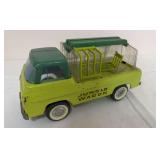 Vintage Nylint Jungle Wagon toy truck with lime green body, green cab roof and clear animal transport enclosure. Features whitewall-style tires and opening cage-style sections. May have a missing piec