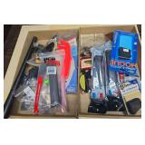Two flats of assorted firearm parts and accessories including ProMag Glock magazine, Pachmayr slip-on pistol grip, Hogue grip, miscellaneous magazines, small parts and other accessories as shown.