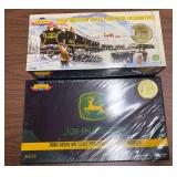 Two boxed Genesis by Athearn John Deere HO scale Precision series sets, including Collector’s Edition 2nd Edition 2002 and 3rd Edition 2003 releases. Both appear to remain wrapped/sealed as shown.