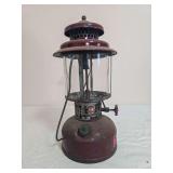 Vintage American Gas Machine Co. AGM Model 2572 pressure lantern with dark burgundy/maroon painted fount, matching ventilator, clear glass globe and black wire frame. AGM Model 2572 identification pla