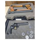 Three Crosman pellet pistols in foam-lined hard case, including a Crosman 357 revolver-style pellet pistol with five rotary pellet clips and two long-barrel pneumatic pump pistols with wood-tone grips