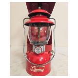 Coleman Model 200A Red Lantern with Case – Marked 7/72. Red single-mantle pressure lantern with matching red porcelain ventilator, clear Pyrex Coleman globe and carrying case; shows paint wear and a