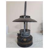 Sears Roebuck Model 742.46 “Brown Bomber” lantern with dark brown/black fount, matching ventilator, clear globe and metal carrying handle. Shows paint loss, surface wear and oxidation consistent w