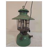 Sears/Preway Model 742-43 Pressure Lantern. Vintage pressure lantern with green painted fount, matching green ventilator, clear cylindrical globe and wire bail handle; shows age-related paint wear, ox
