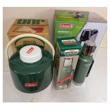 Coleman QuikPot+ coffeemaker in original box, two Stanley vacuum bottles/thermoses and Coleman insulated jug. Includes original packaging for one Stanley bottle and the Coleman jug as shown.
