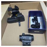 Crimson trGroup of firearm sights and optics including Crimson Trace, NcStar and an EOTech-type sight; cataloger notes the EOTech is very possibly a knockoff. Includes mounts and boxed components as s