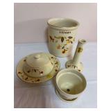 Four China Specialties Autumn Leaf pieces comprising a utensil crock, lidded serving dish with underplate, flower pot with saucer, and bud vase. Markings identify China Specialties limited-edition pro