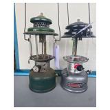 Coleman Models 220E & 295 Lanterns – Marked 10/56 & 3/99. Includes vintage green Model 220E pressure lantern and later gray Powerhouse Dual Fuel Model 295 with clear globes and wire bail handles; sh