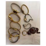 Group of vintage and later women’s wristwatches in assorted gold-tone and silver-tone styles, along with a pocket watch and leather holder as shown. Mixed makers and styles.