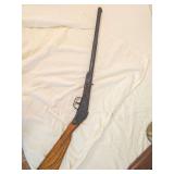 1938 Daisy No. 100 Model 38 single-shot air rifle with wood stock and metal barrel/action. Shows age-related finish wear and oxidation as shown.