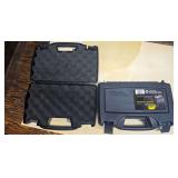 Two Plano Protector Series single-pistol hard cases with molded black shells, carrying handles and foam interiors.