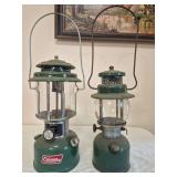 Coleman Models 220K & 242C Lanterns – Marked 5/82 & 4/47. Green pressure lanterns representing later and earlier Coleman designs, with clear globes and wire bail handles; shows age-related wear, oxi