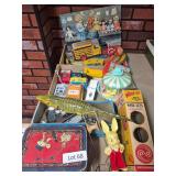 Three flats of assorted vintage toys including tin and plastic vehicles, toy alligator, Whee-Lo magnetic spinning wheel toy, plastic carousel, educational items and other toys as shown. Mixed makers, 