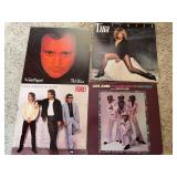 Group of modern country and rock vinyl record albums as cataloged, with visible titles including Phil Collins No Jacket Required, Tina Turner Private Dancer, Huey Lewis and the News Fore! and Love Jon