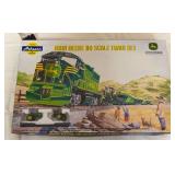Athearn John Deere HO scale train set featuring John Deere No. 2005 diesel locomotive, themed rolling stock and two miniature John Deere tractors. Set is housed in the original illustrated John Deere 