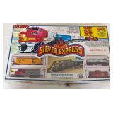 Bachmann Silver Express HO scale electric train set, advertised as an 83-piece set with Santa Fe diesel locomotive, cars, 36" x 45" track oval and bridge/trestle components.