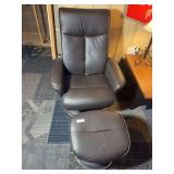 Chair with ottoman. Brownish black faux leather. Chair will recline