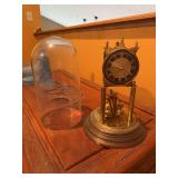 Mantel clock. Appears to be missing  a part. As is