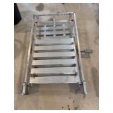 Aluminum cargo carrier with ramp. Appears to be complete