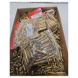 Flat of mostly un sorted rifle and pistol brass