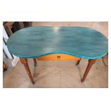 Kidney shaped table on wheels