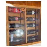 Coca Cola bottles in display case