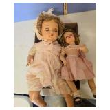 2 plastic dolls