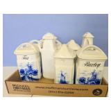 Flat of decorative kitchen containers have chips