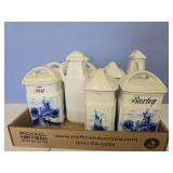 Flat of decorative kitchen containers have chips