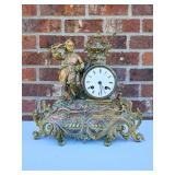 Brass mantel clocks  as shown. Bugle boy and girl with bird on hand
