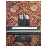 Mat cutters and paint brushes