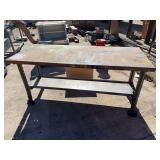 Shop table with metal legs and wood top. 72” wide by 30” deep by 34.5” tall