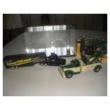 (3) Trucks & Display Case  largest 8 inches